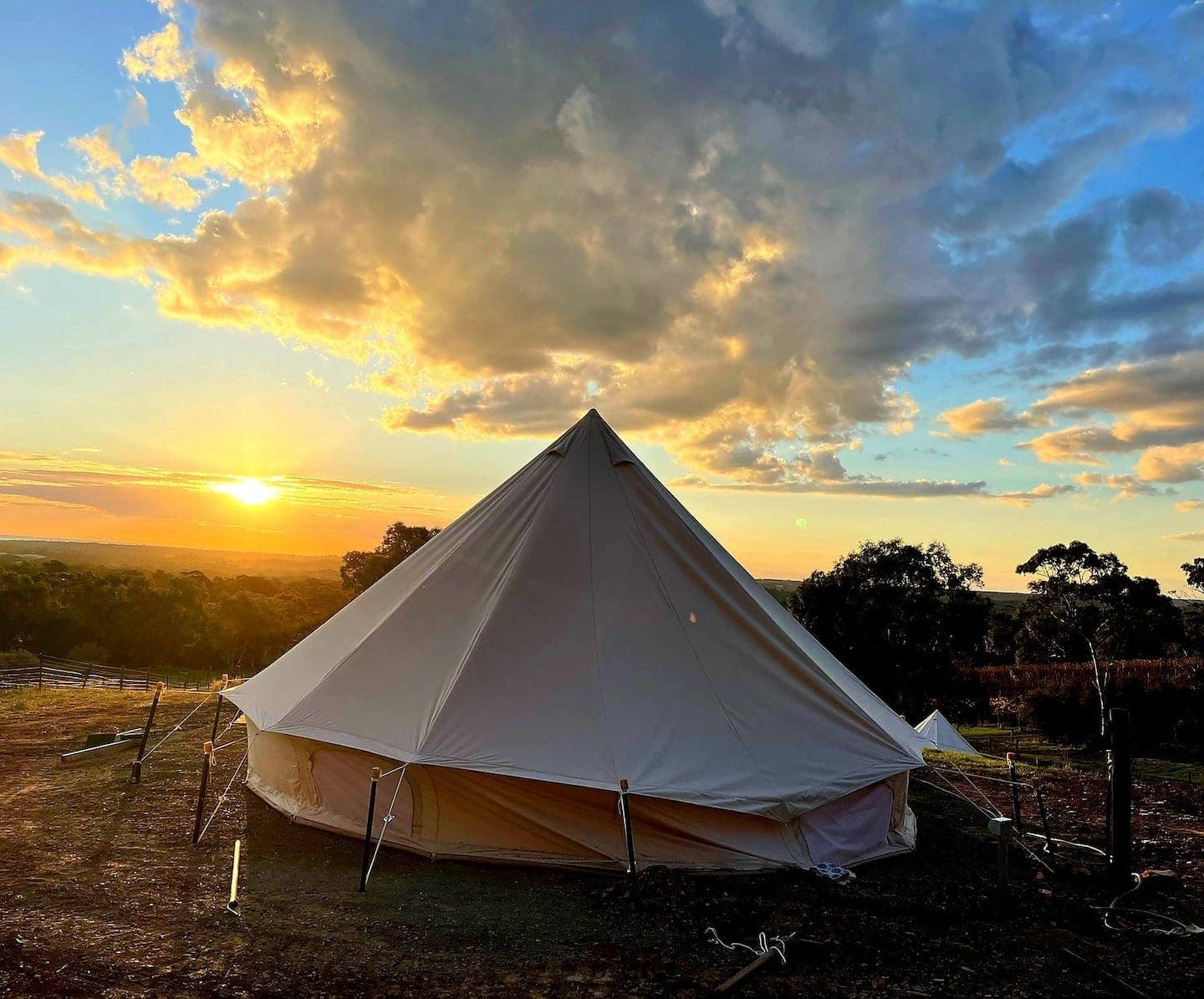 The bell tent at sunset, the Vale glowing gold behind it