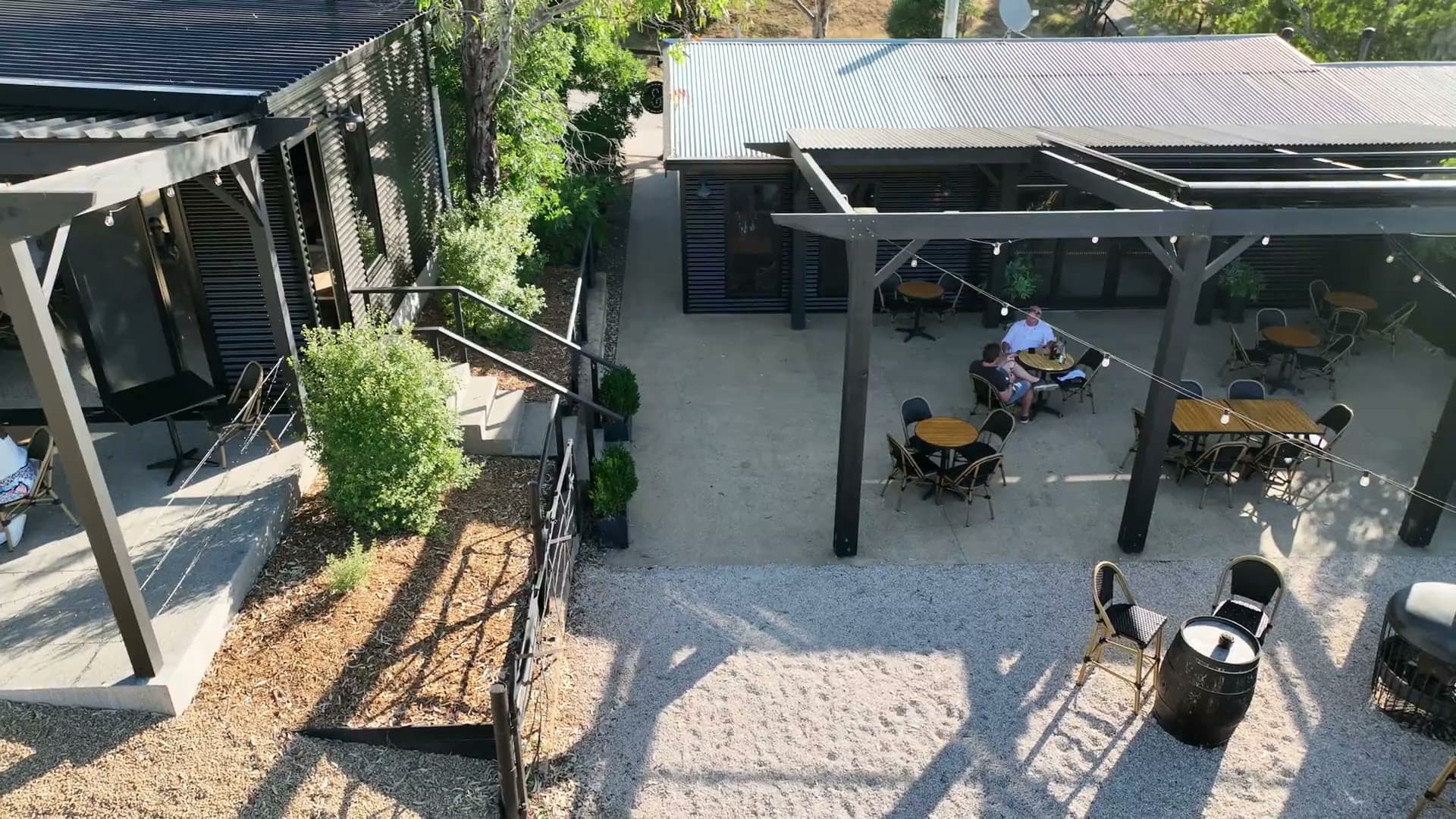 Aerial drone view rising over the cellar door terrace and event space at The Range